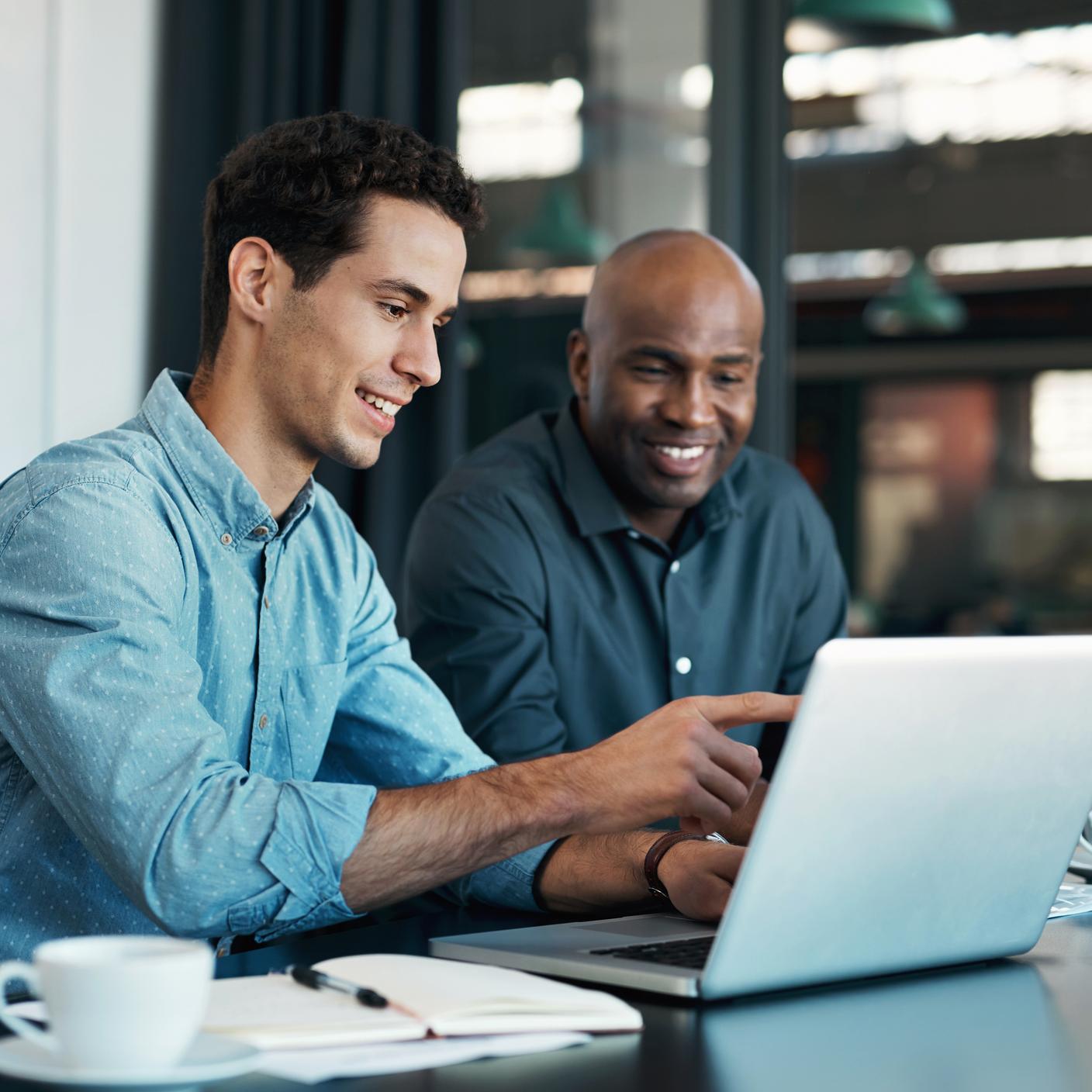 men looking at laptop 