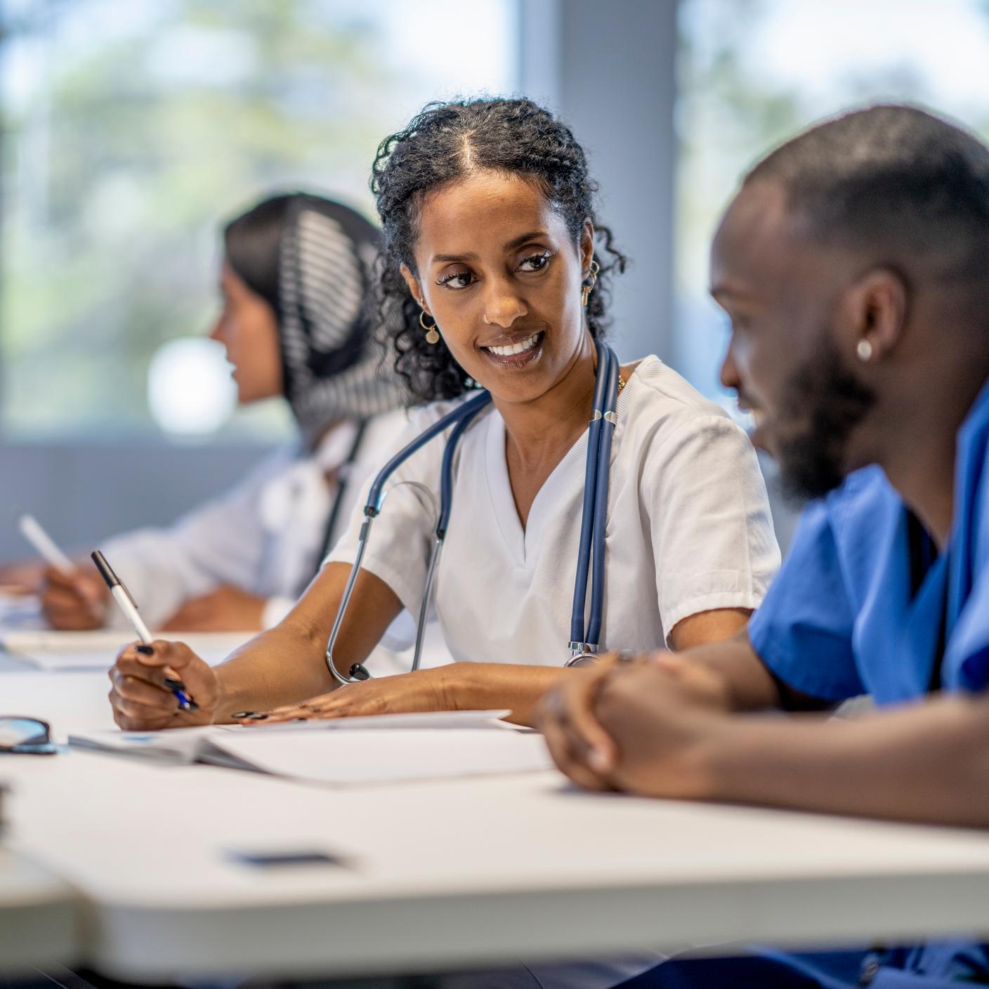 Two future doctors studying and talking togheter