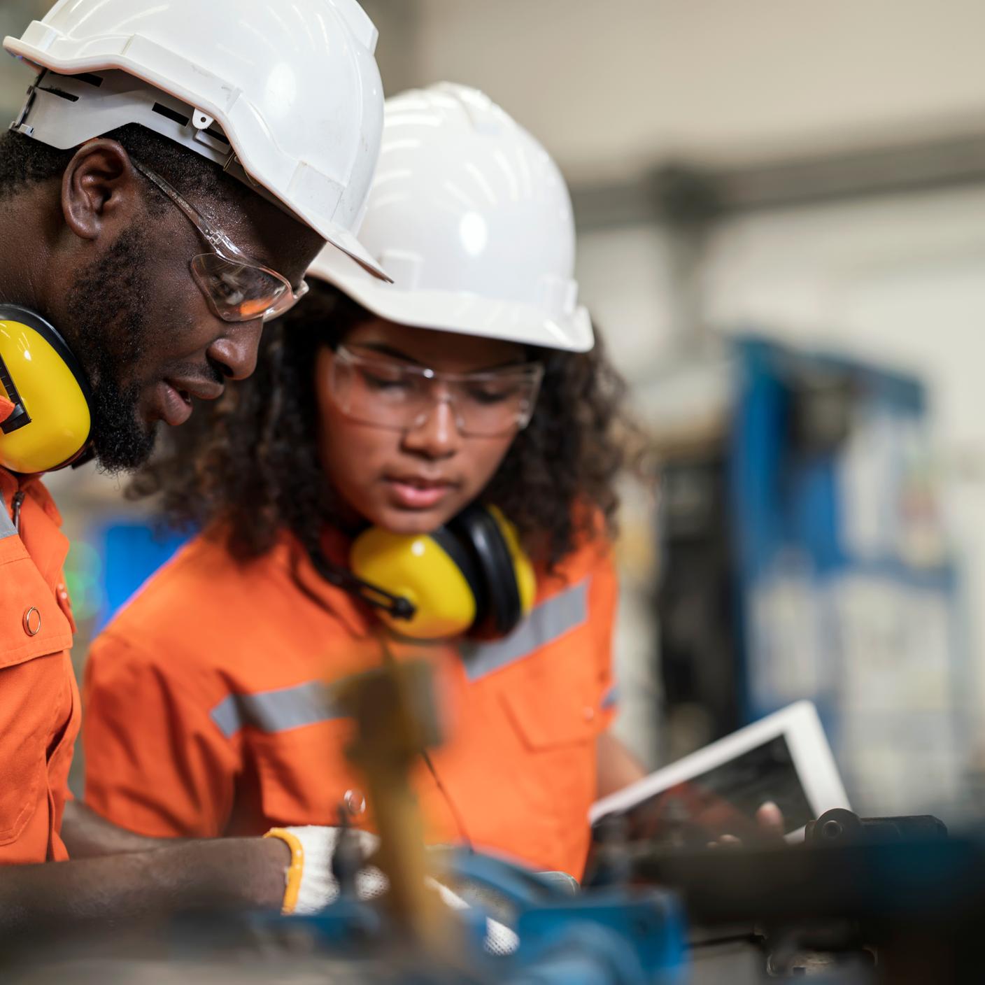 African american manufacturing process engineers team having discussion