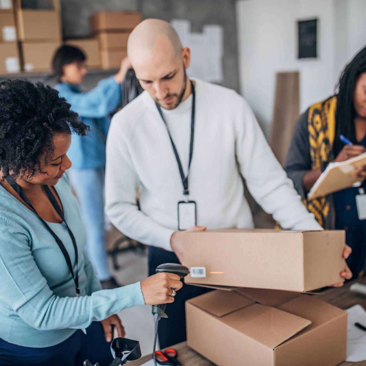 people marking packages with device