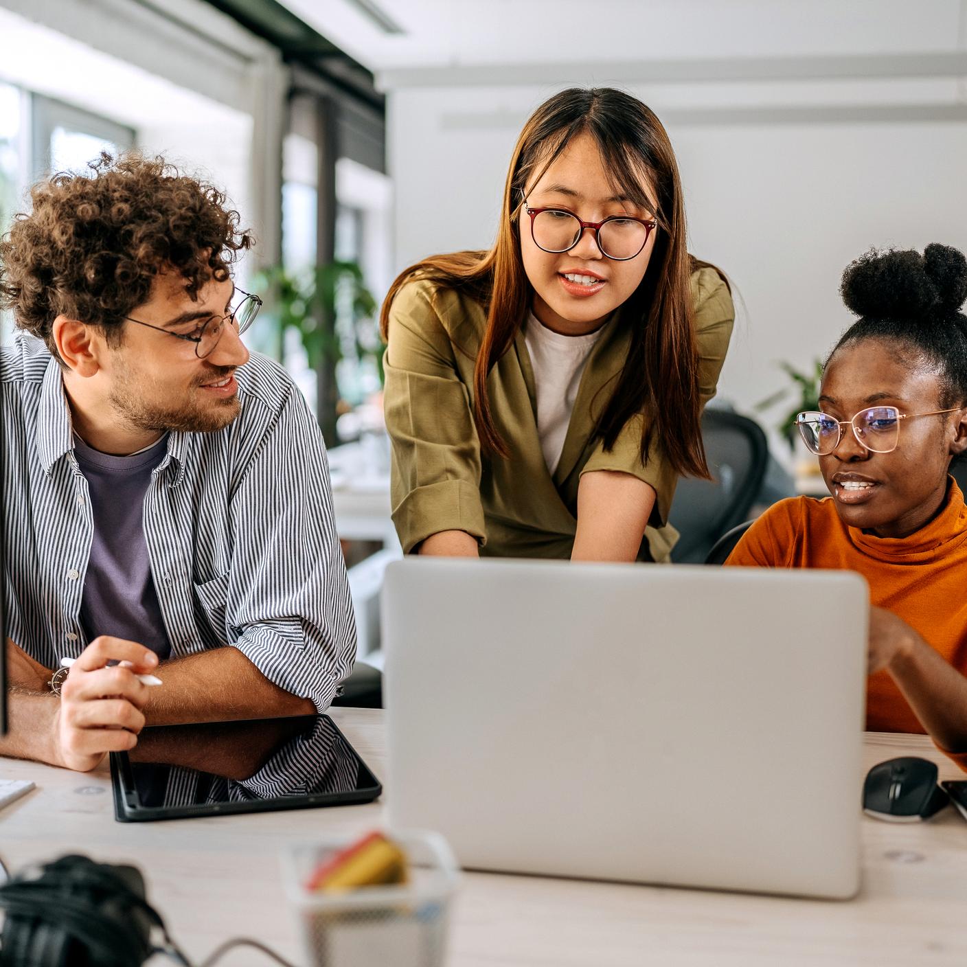 Manager working with team in a modern office