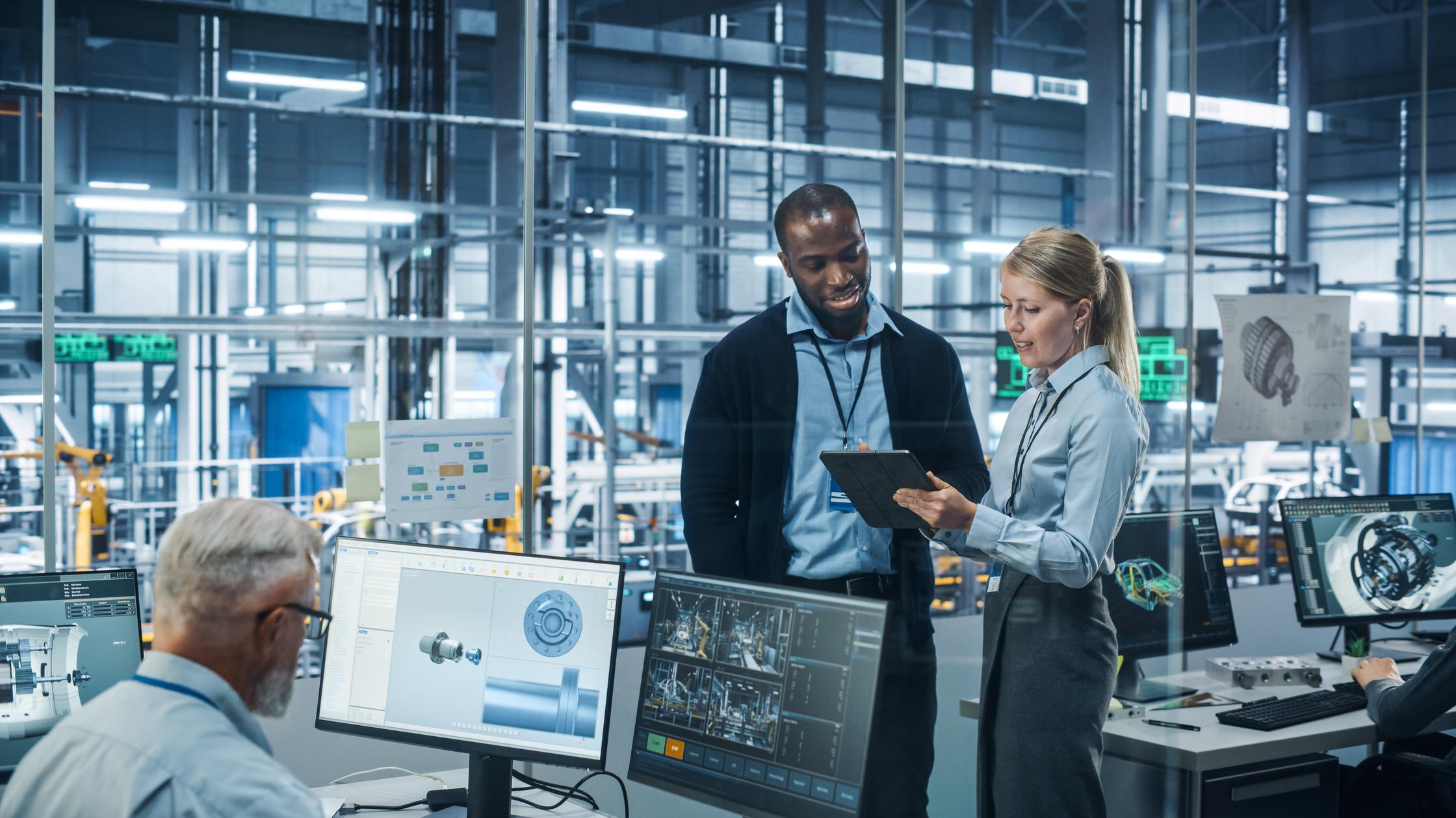 A group of engineers working on automotive